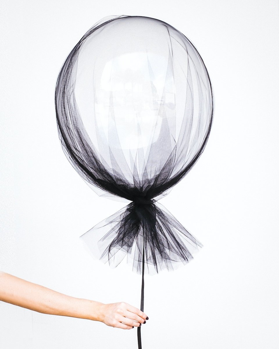 A white balloon covered with fabric as a DIY photography prop