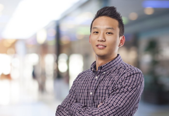 Young man with folded arms