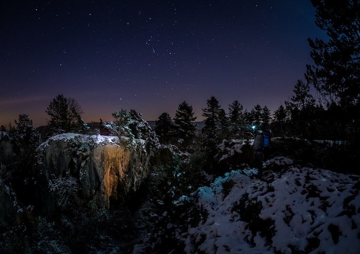 Stunning photo of the milky way over a snowy landscape at night