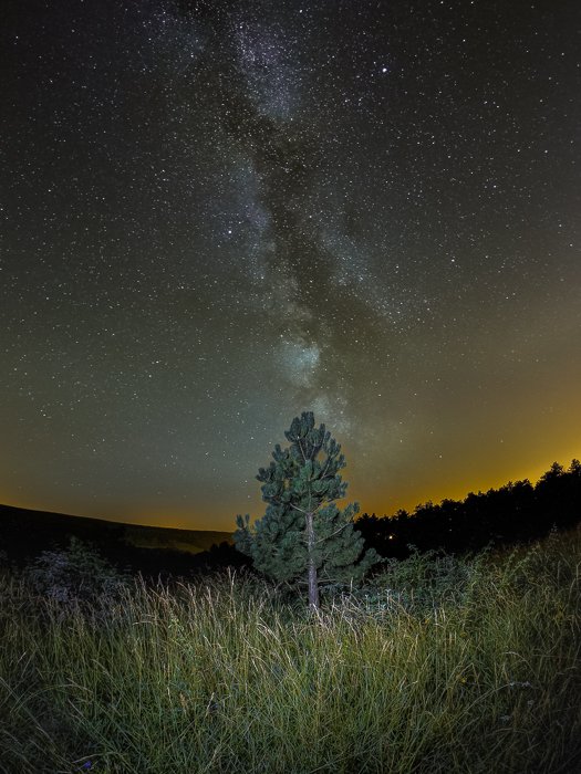 Stunning photo of the milky way over a landscape at night